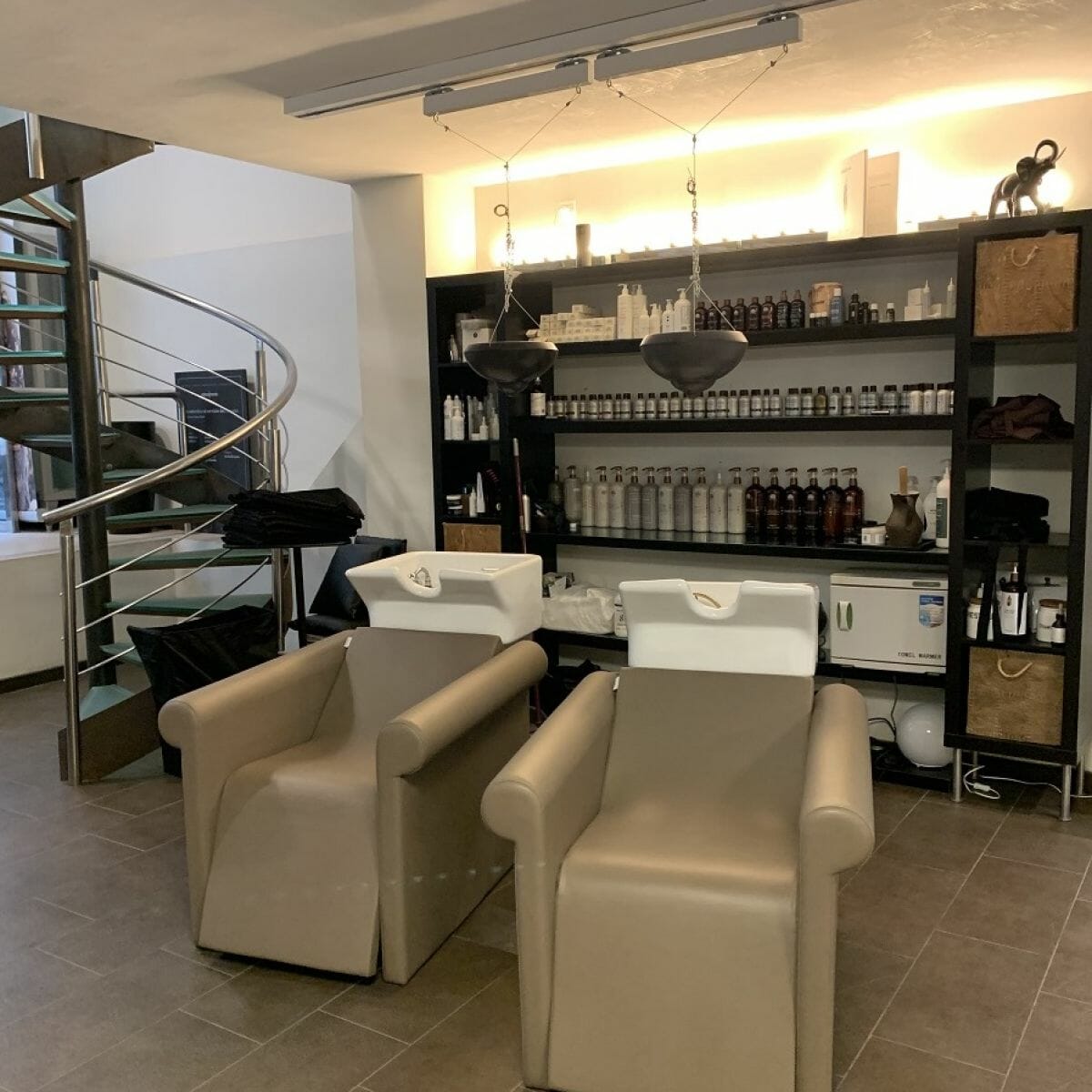 Moran Perruquers, Spain featuring a coordinating selection of Nelson Mobilier Salon Furniture in a contemporary setting.